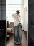 Oatmeal colorway with grey wide-leg trousers and polka-dot bag