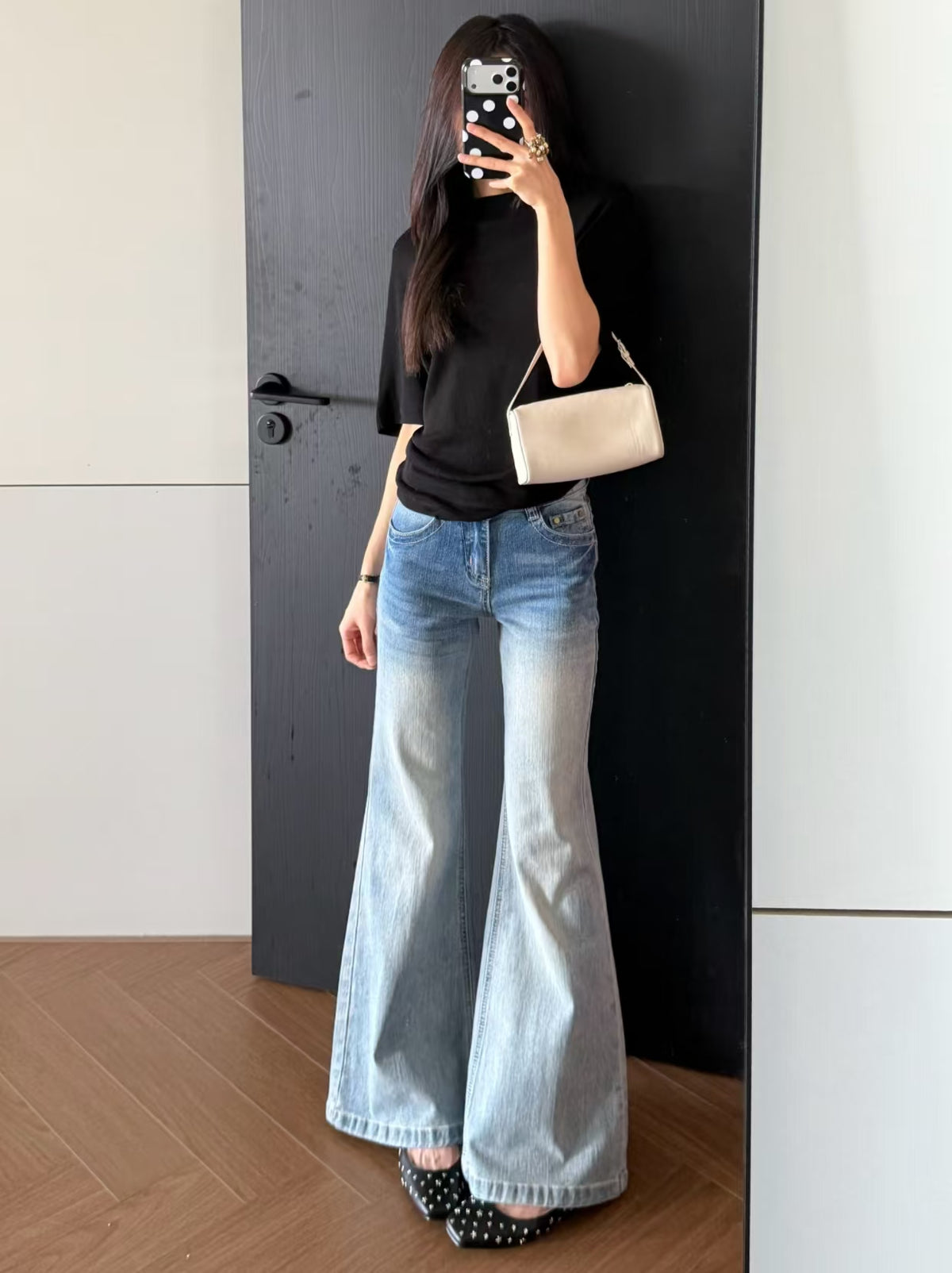 Low Rise Light Wash Flare Jeans - back view walking