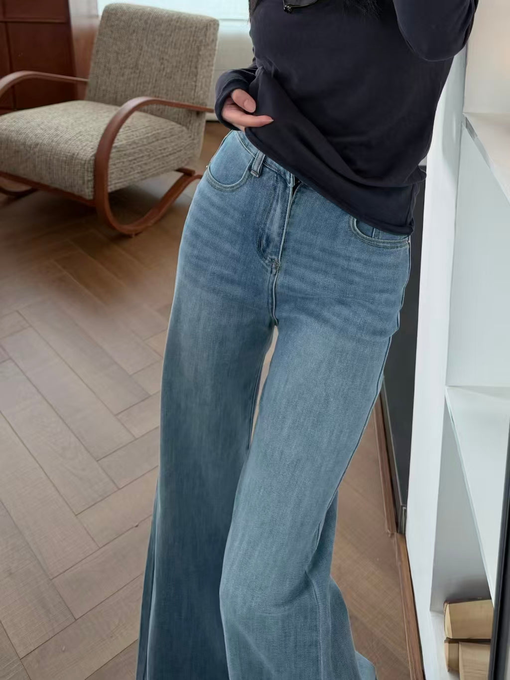 Hem and sneaker detail of flare jeans